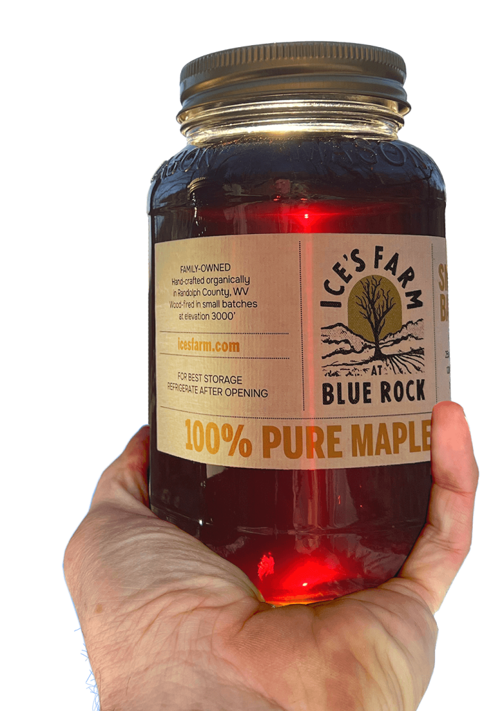 Holding a jar of our 100% pure Appalachian mountain maple syrup